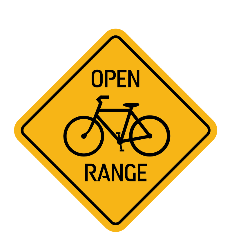 Yellow road sign with a bicycle and text "Open Range".