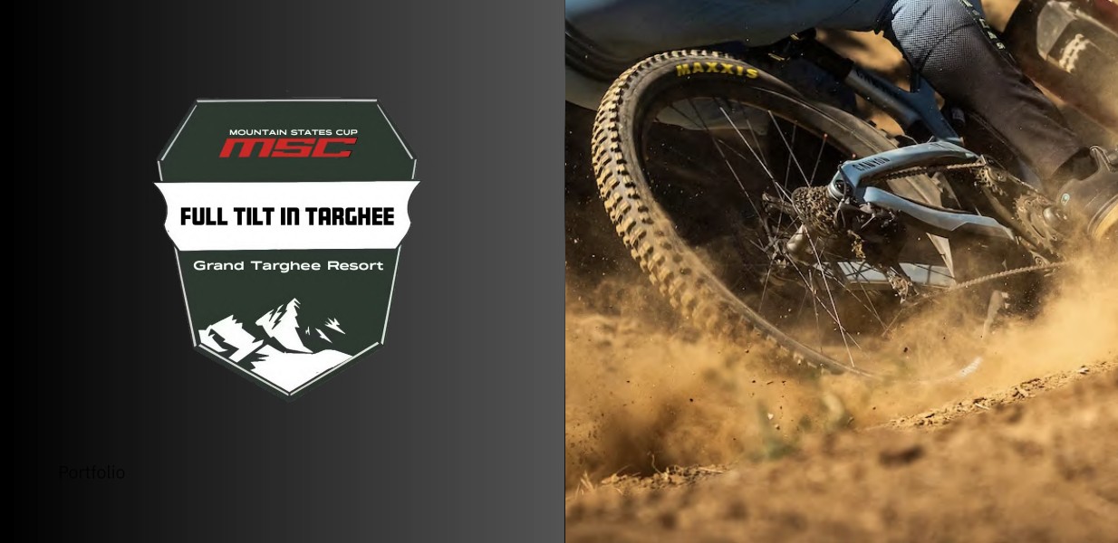 Bike tire kicking up dirt next to a racing logo.