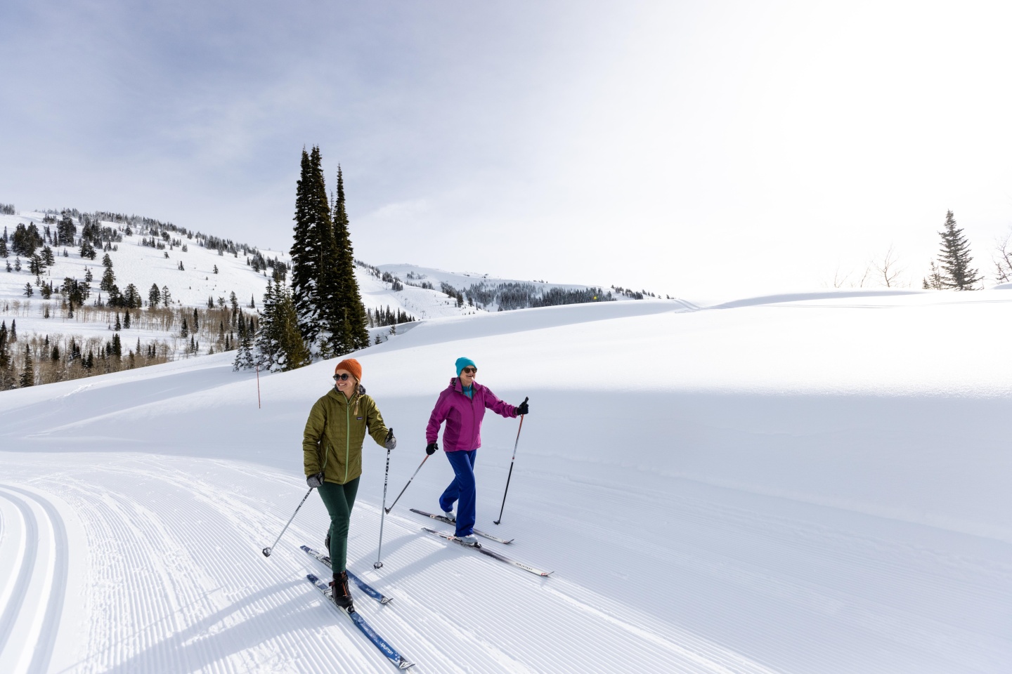 Two women cross country skiing