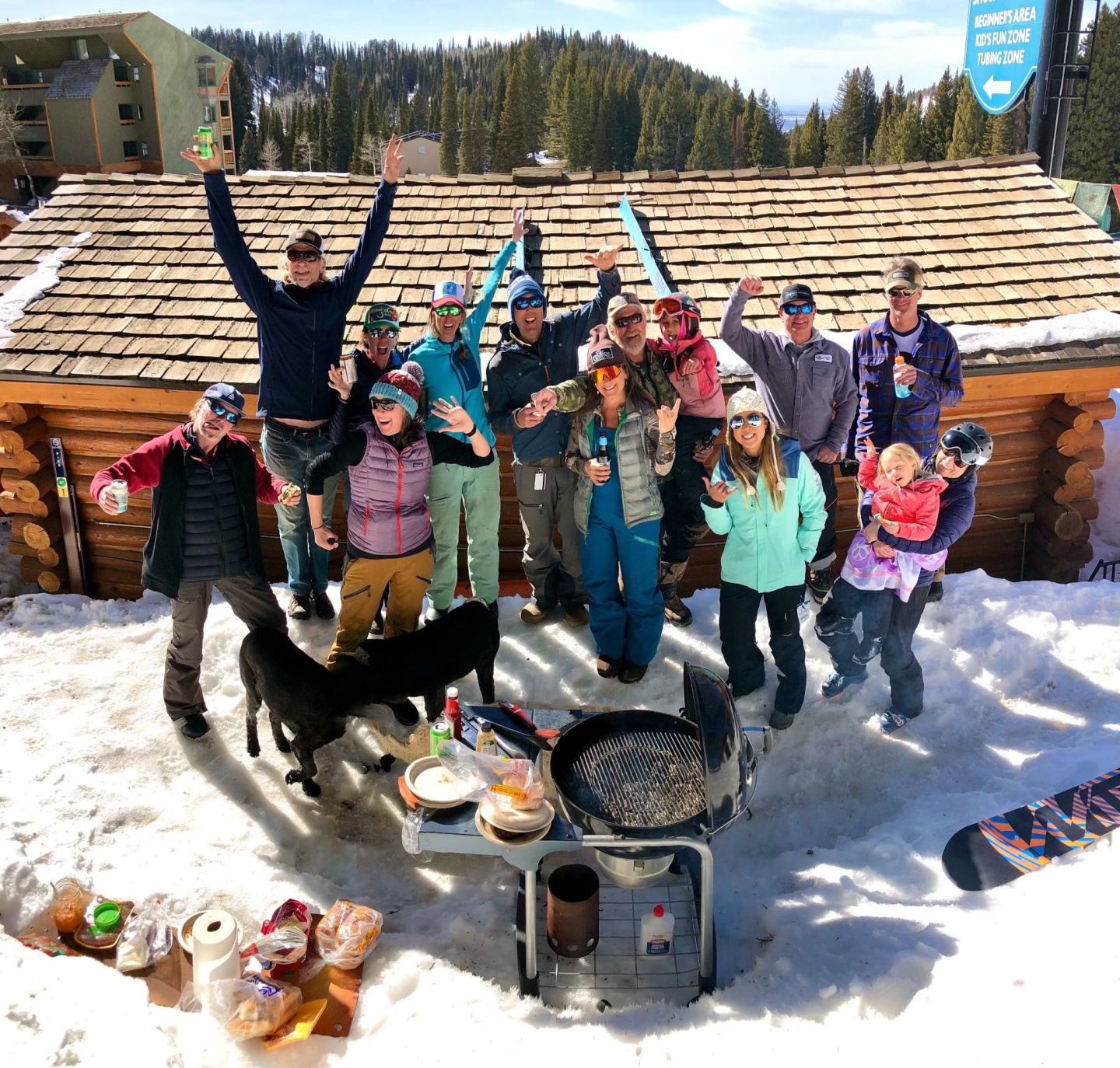 A group of cat skiers enjoy a barbeque