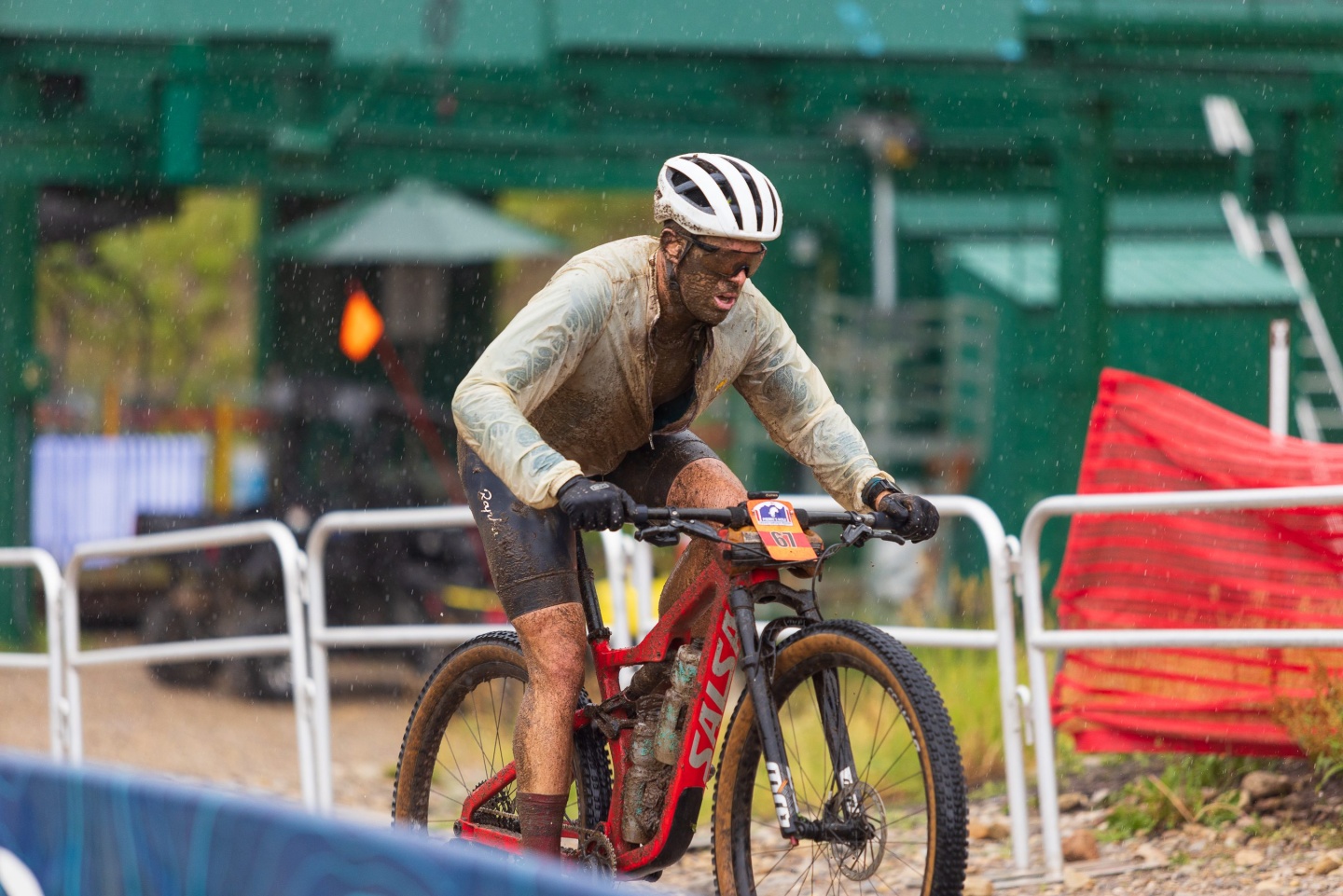 a man cycling at the base of a resort