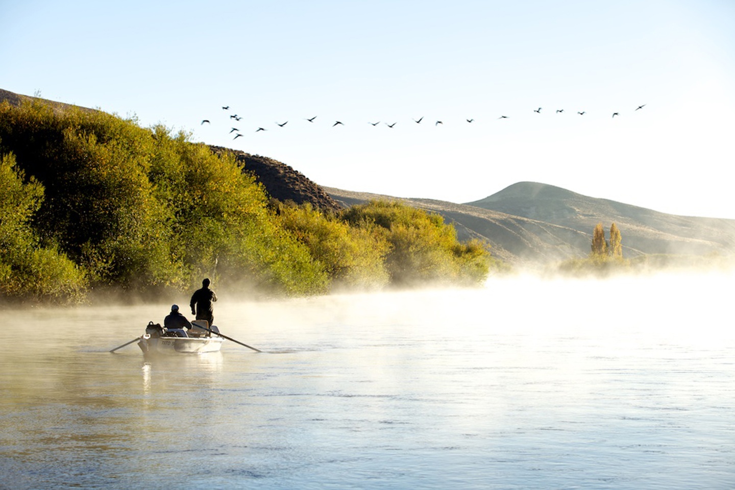 Two fisherman on a lake