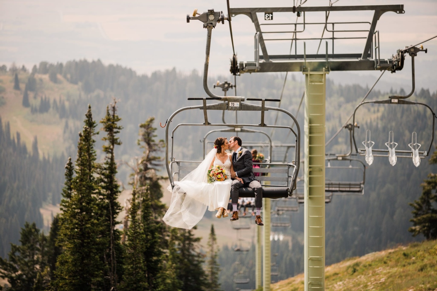 Bride and groom on chairlift