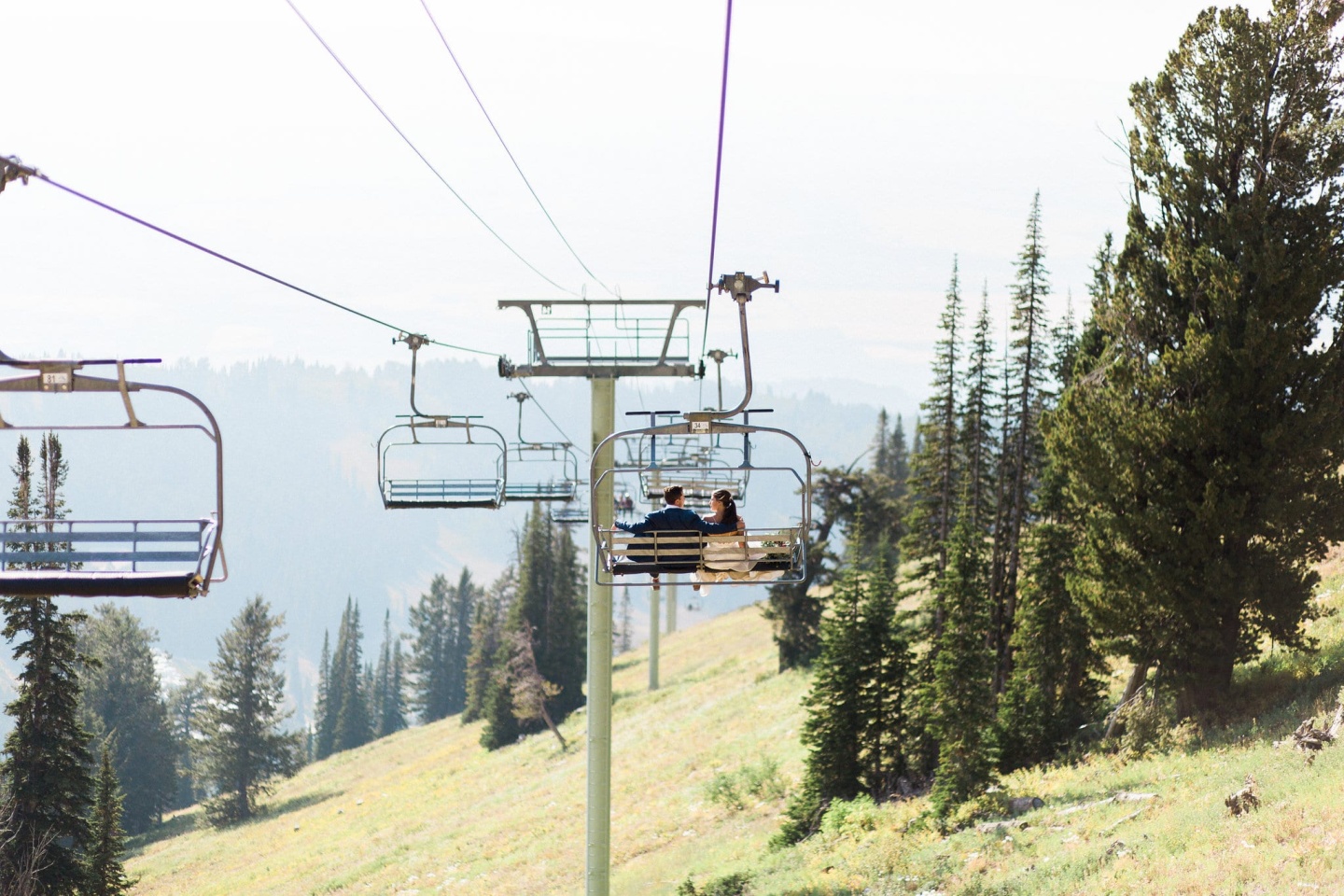 Bride and groom on chairlift
