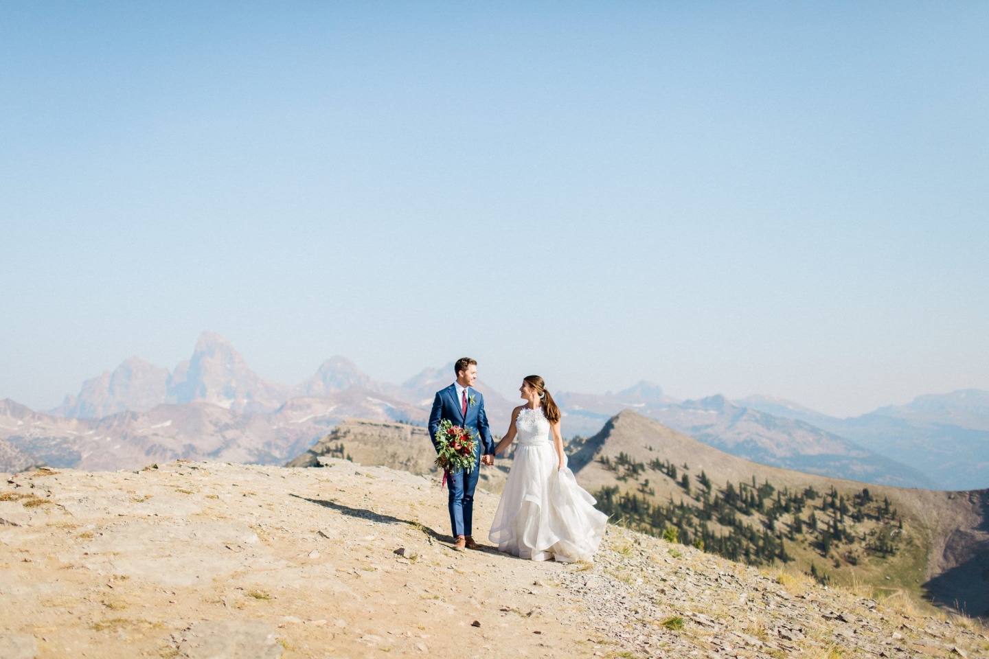 Bride and groom in mountains