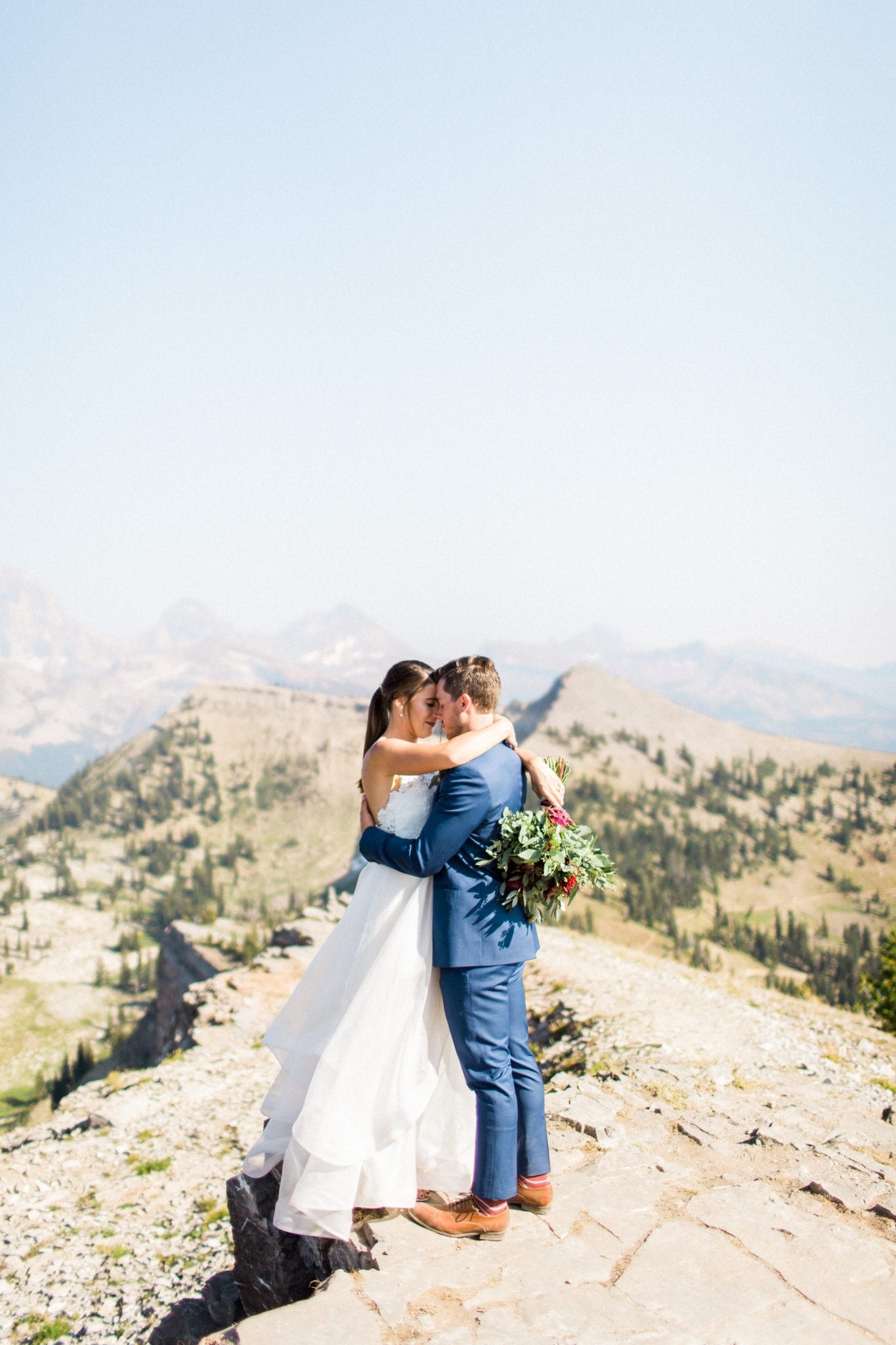Bride and groom on mountain top