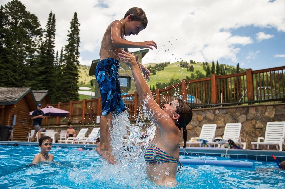 A mother and child in a pool