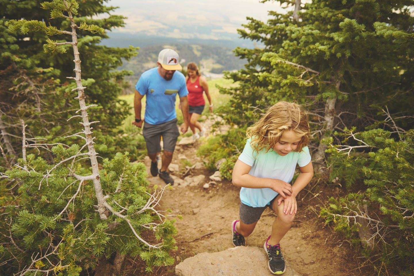 A family of four hiking on a mountain