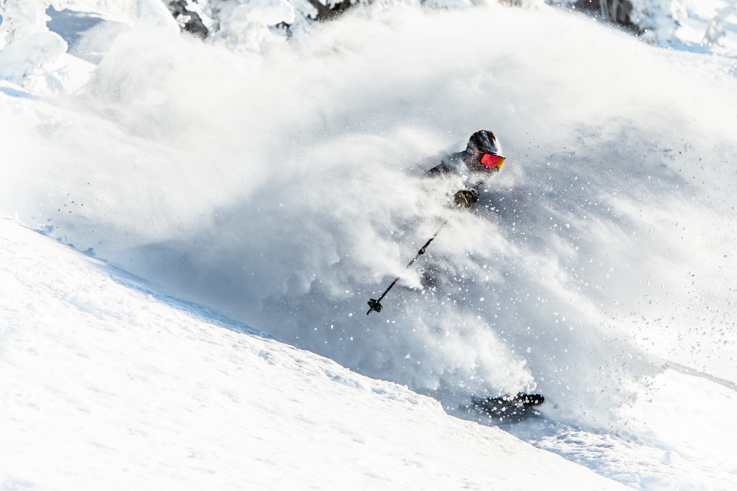Skiier in deep powder at Grand Targhee Resort