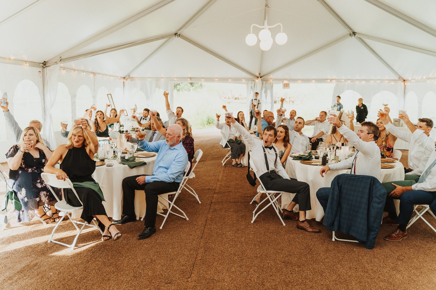 Wedding guests in a tent
