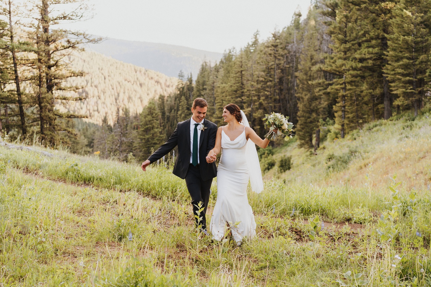 A bride and groom on a mountain