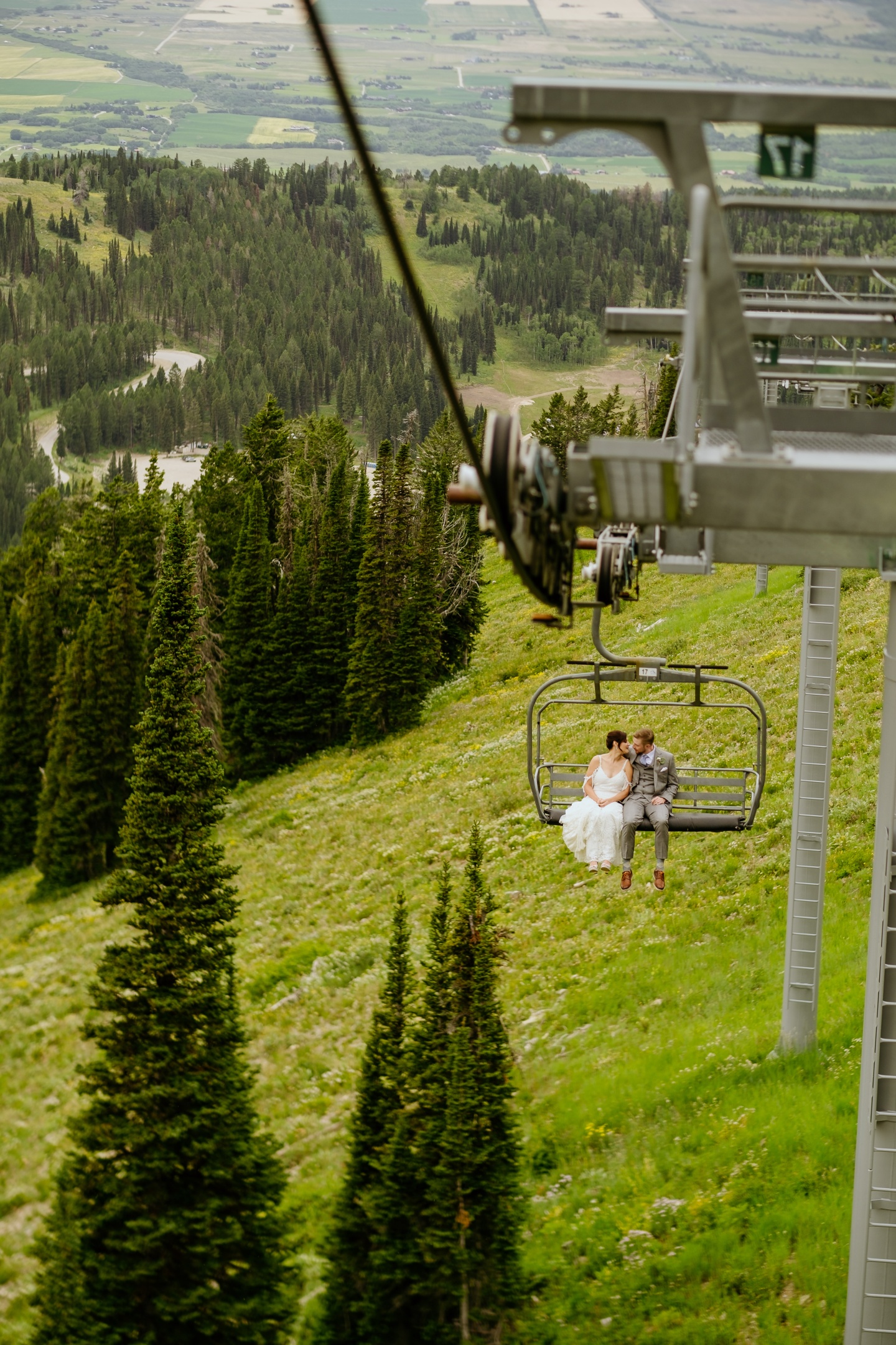 A bride and groom on a chairlift