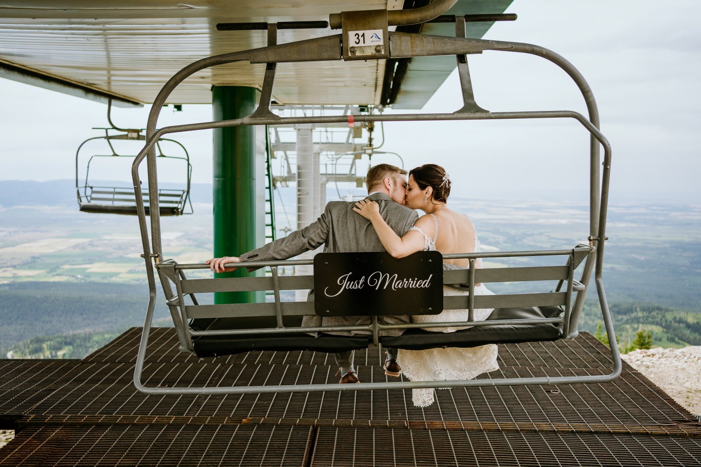 A bride and groom on a chairlift