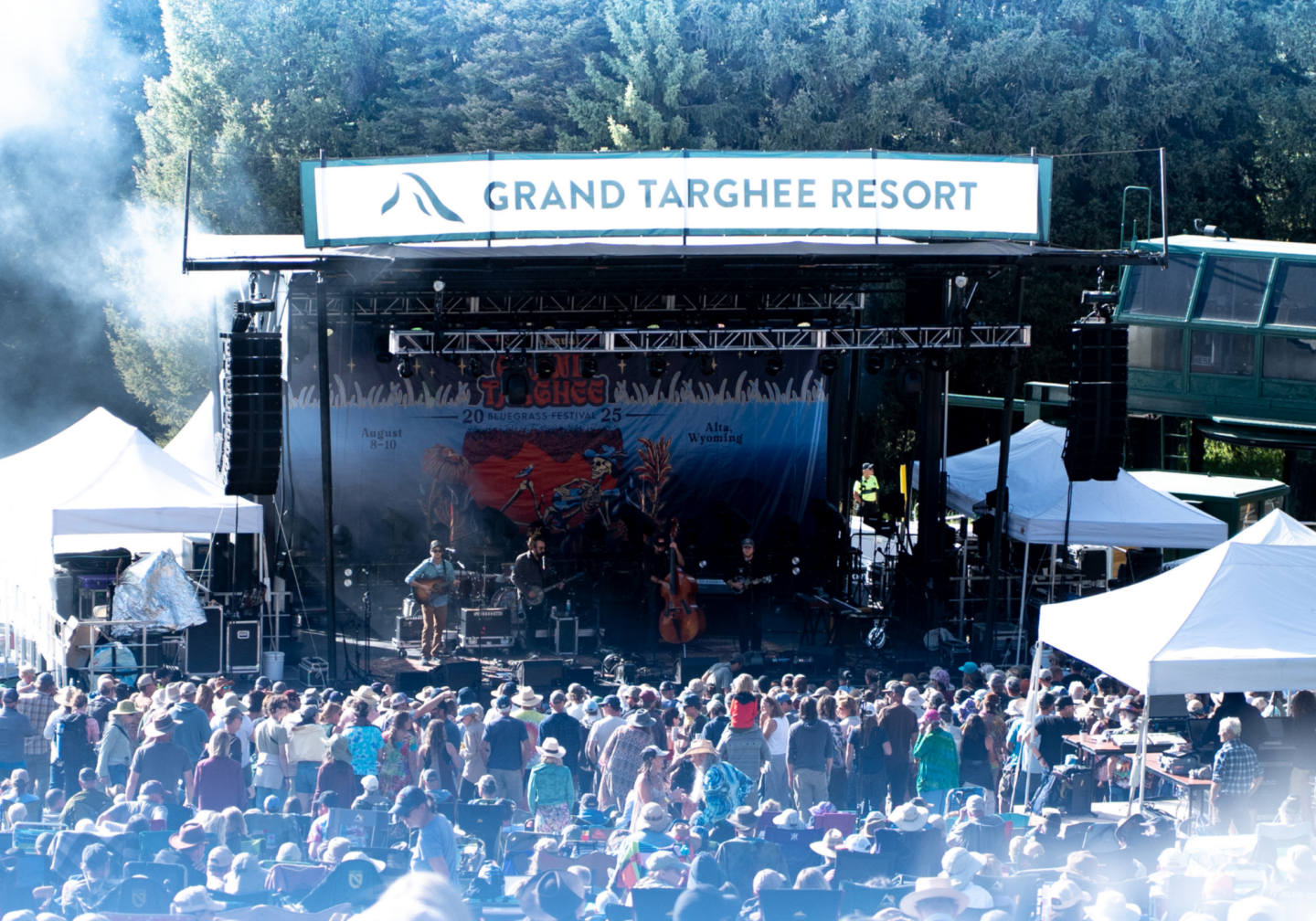 Outdoor concert at Grand Targhee Resort with crowd and stage.